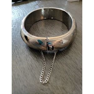 VINTAGE SILVER TONE BRACELET WITH 2" SAFTEY CHAIN. CLASP WORKS GREAT. PRETTY!